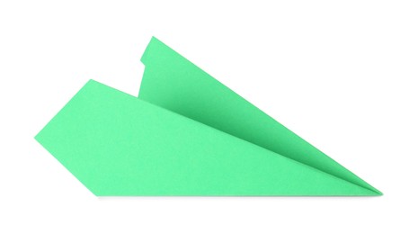 Photo of One handmade green paper plane isolated on white