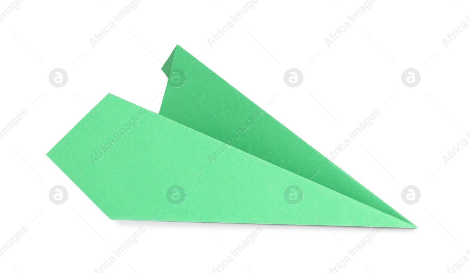 Photo of One handmade green paper plane isolated on white