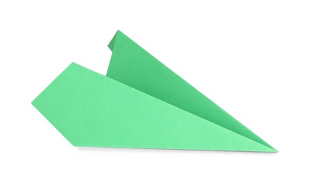 Photo of One handmade green paper plane isolated on white