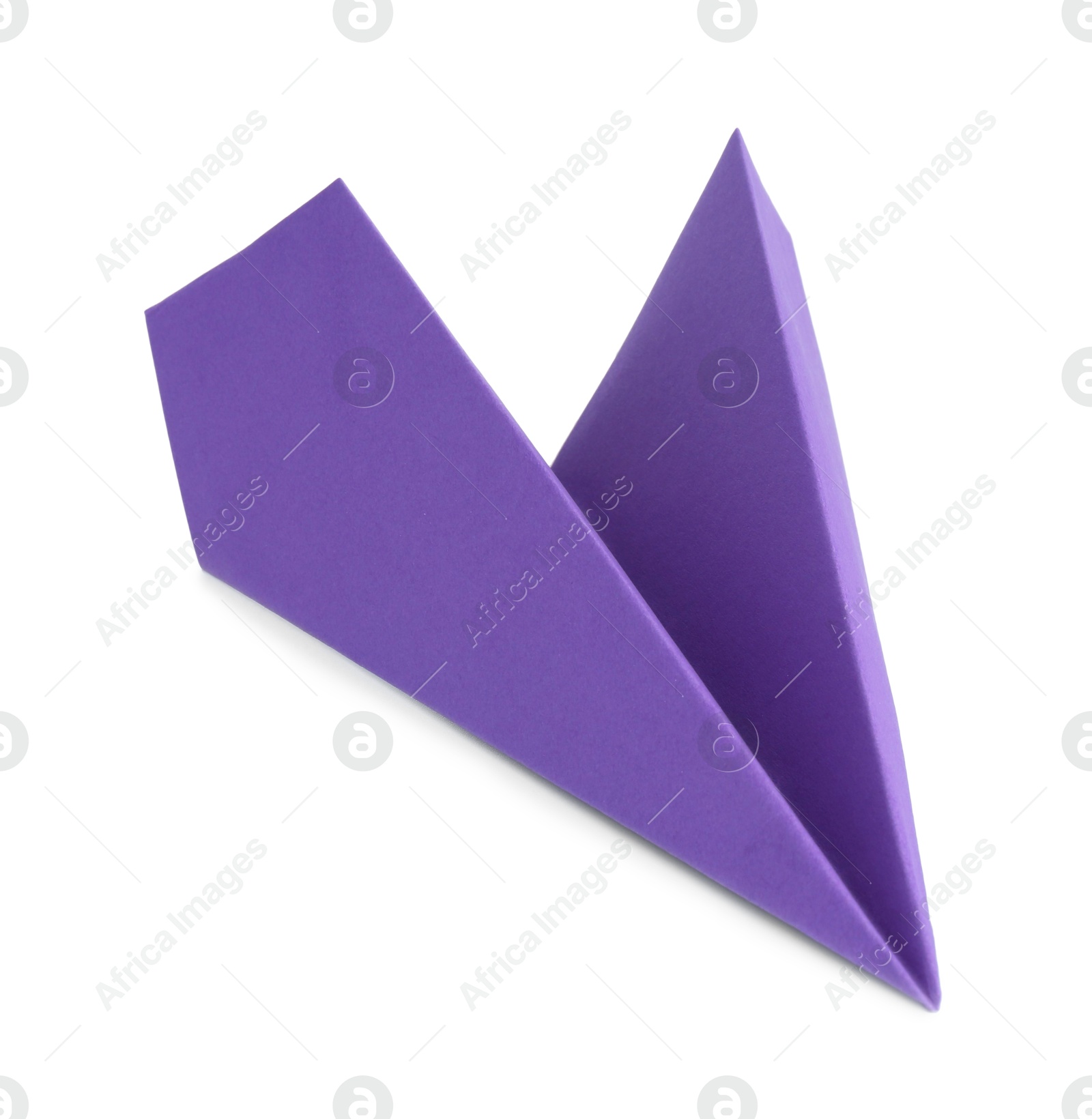 Photo of One handmade purple paper plane isolated on white