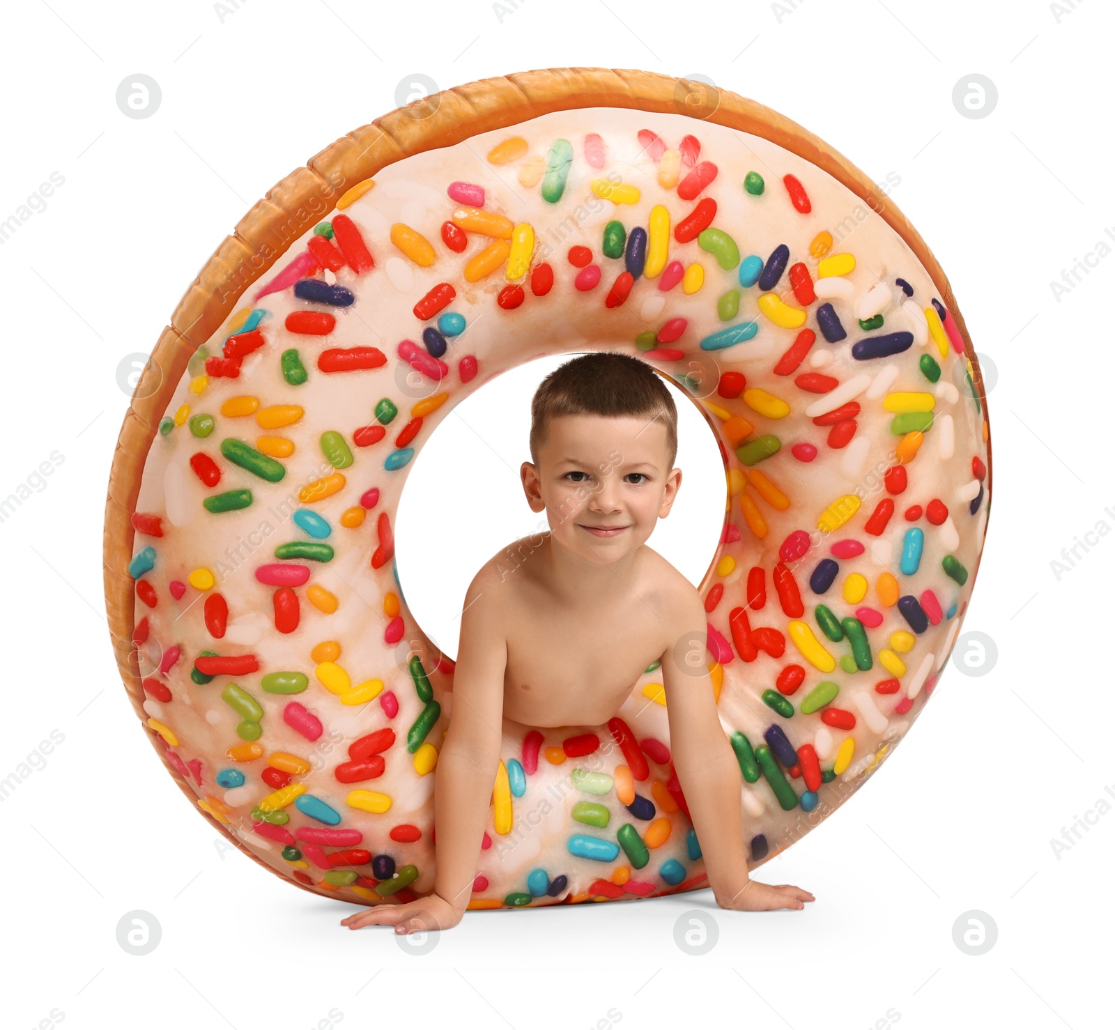 Photo of Cute little boy in beachwear with inflatable ring on white background