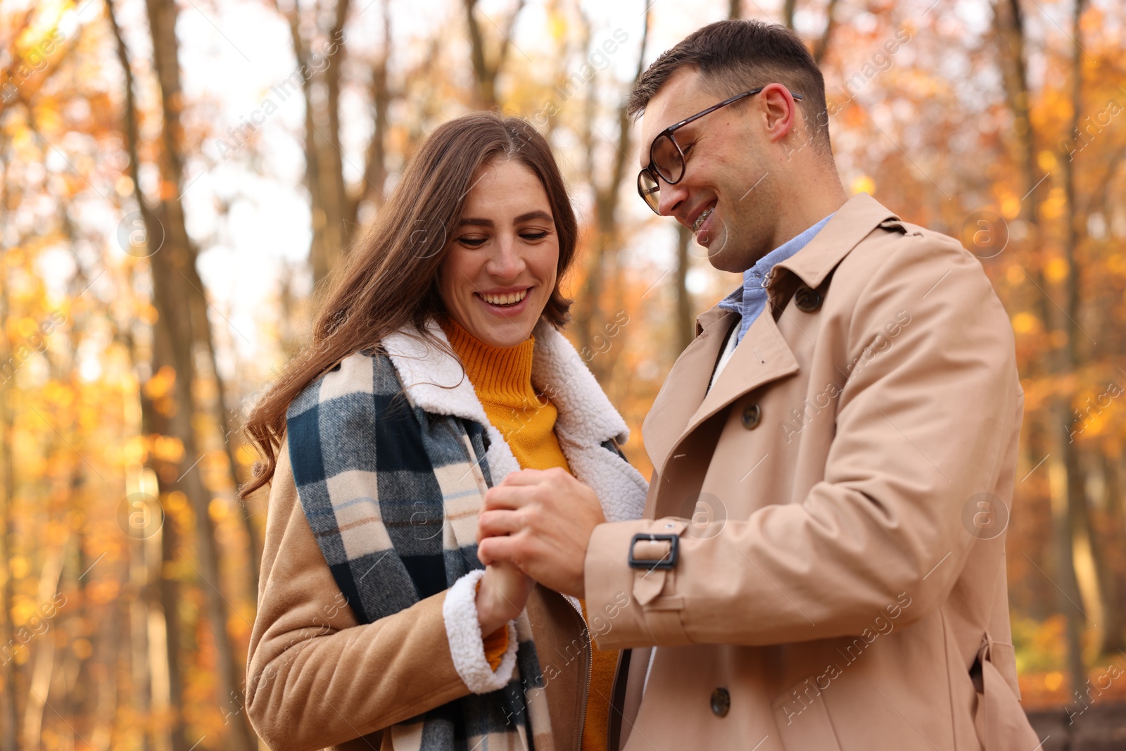 Photo of Happy couple spending time together in autumn park