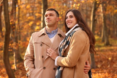 Photo of Happy couple spending time together in autumn park