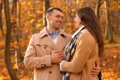 Photo of Happy couple spending time together in autumn park