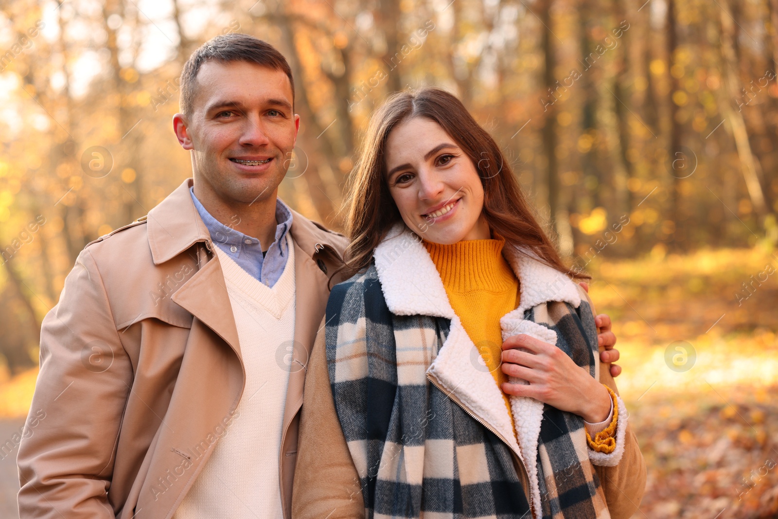 Photo of Happy couple spending time together in autumn park