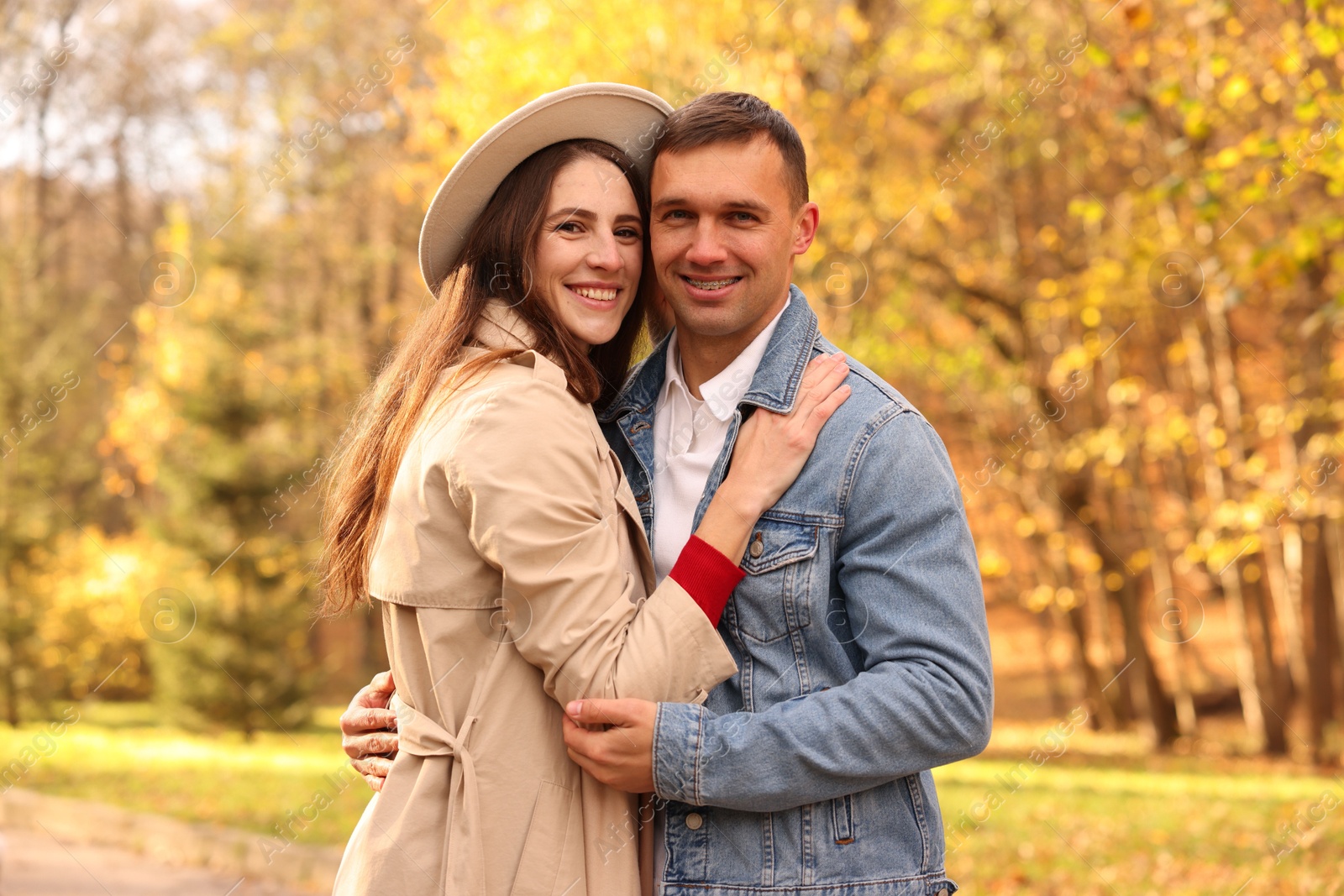 Photo of Happy couple spending time together in autumn park