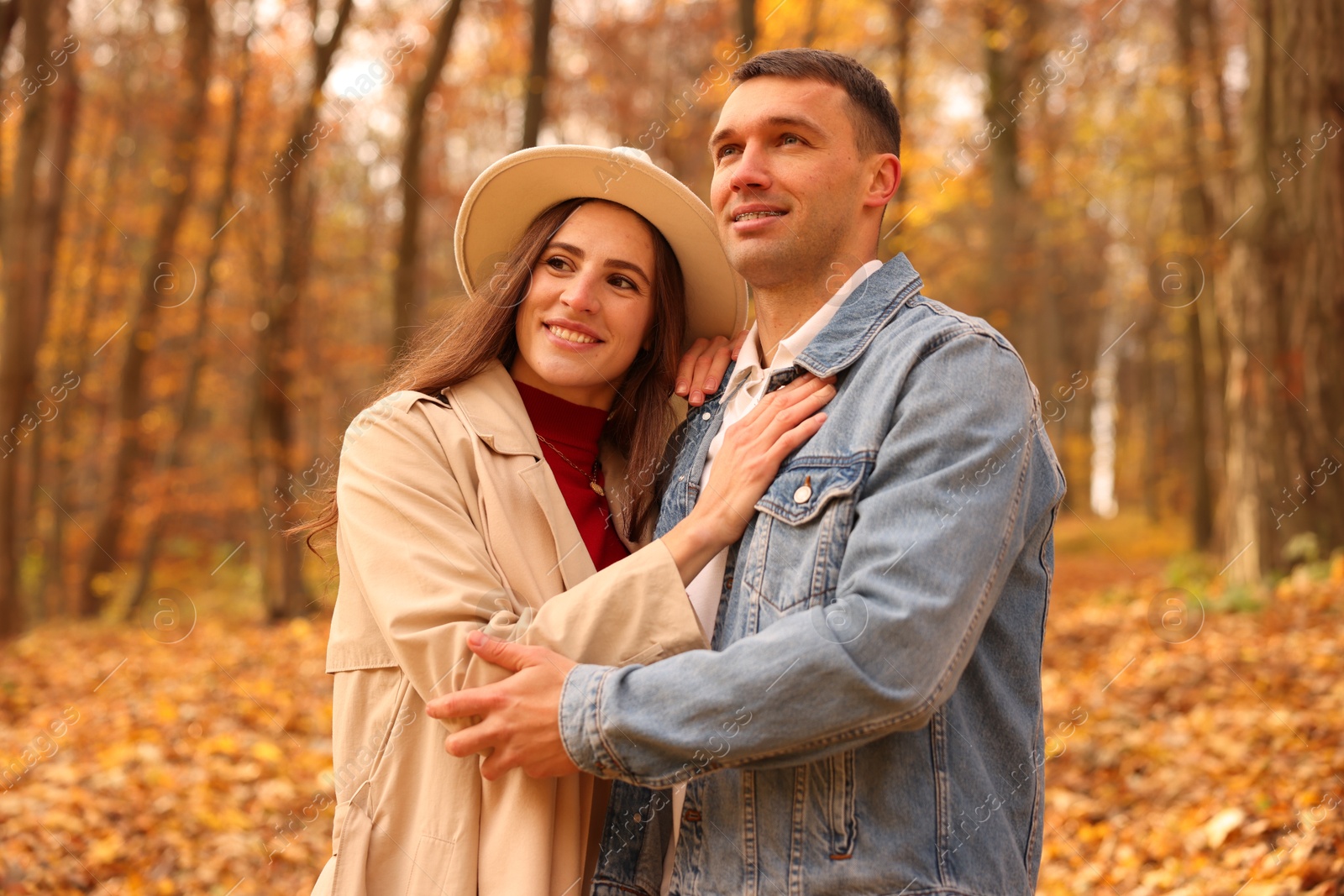 Photo of Happy couple spending time together in autumn park