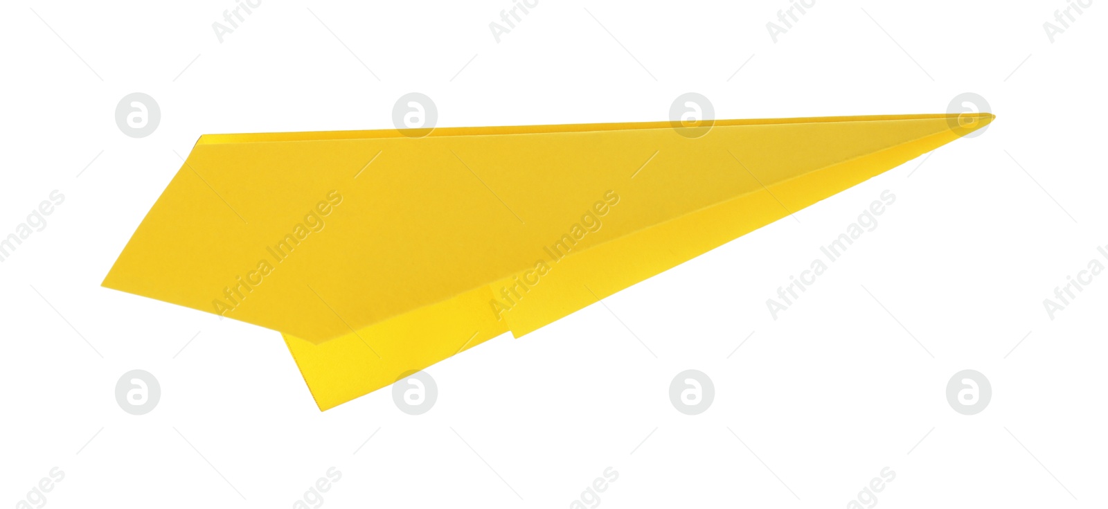 Photo of One handmade yellow paper plane isolated on white