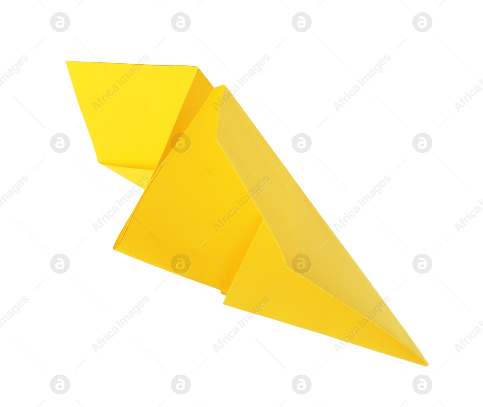 Photo of One handmade yellow paper plane isolated on white