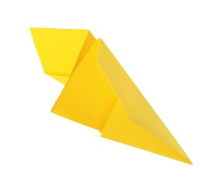 Photo of One handmade yellow paper plane isolated on white