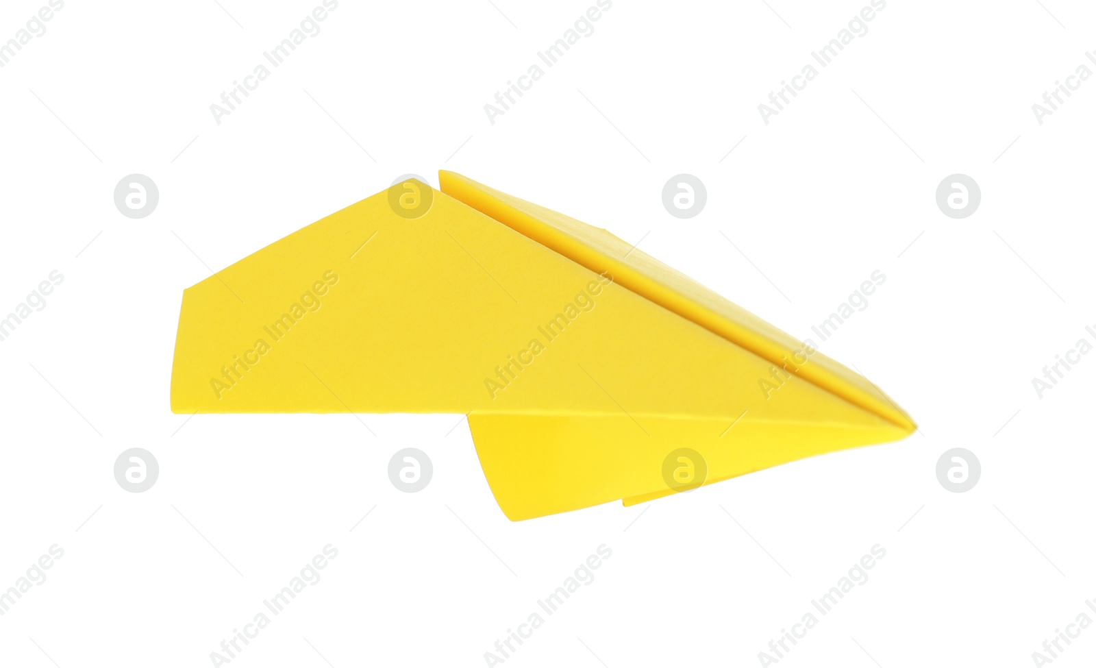 Photo of One handmade yellow paper plane isolated on white