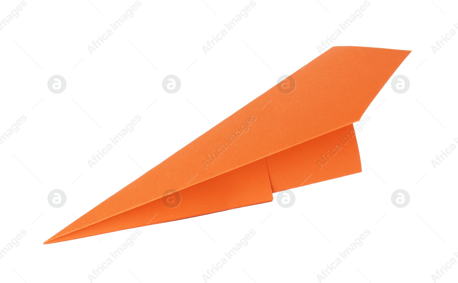 Photo of One handmade orange paper plane isolated on white