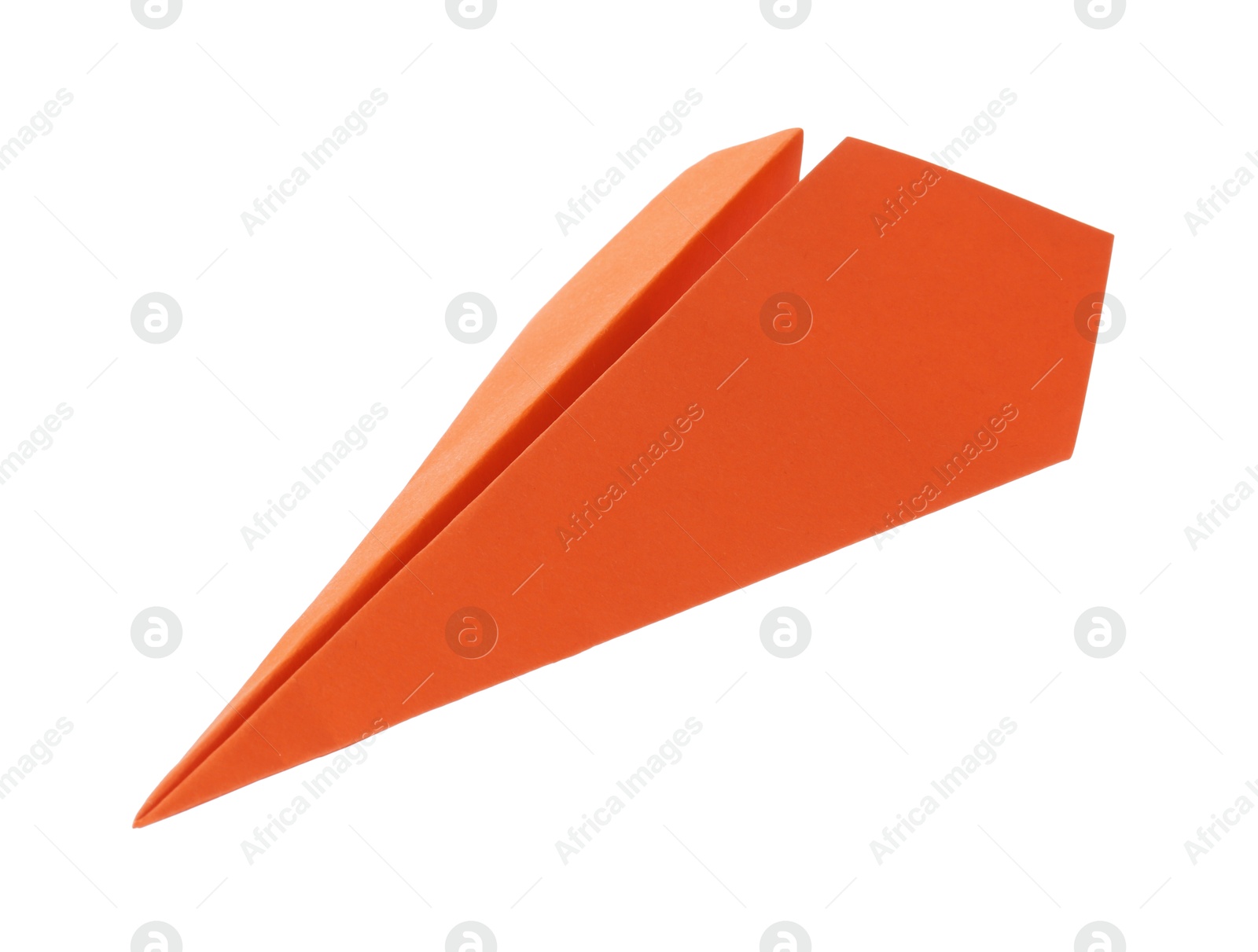 Photo of One handmade orange paper plane isolated on white