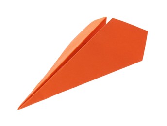 Photo of One handmade orange paper plane isolated on white