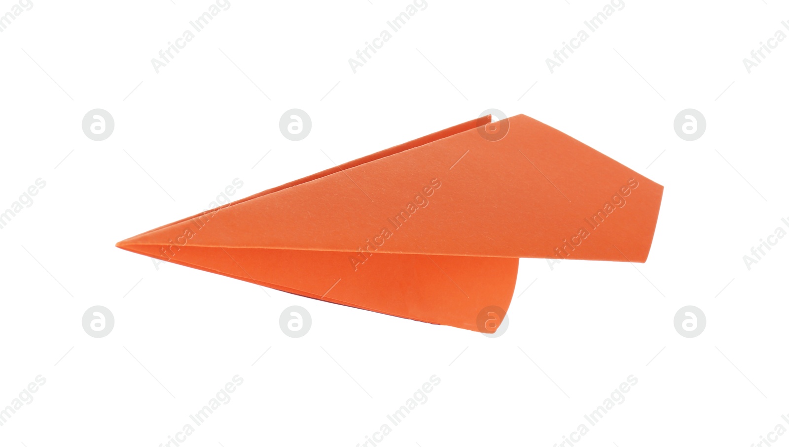 Photo of One handmade orange paper plane isolated on white