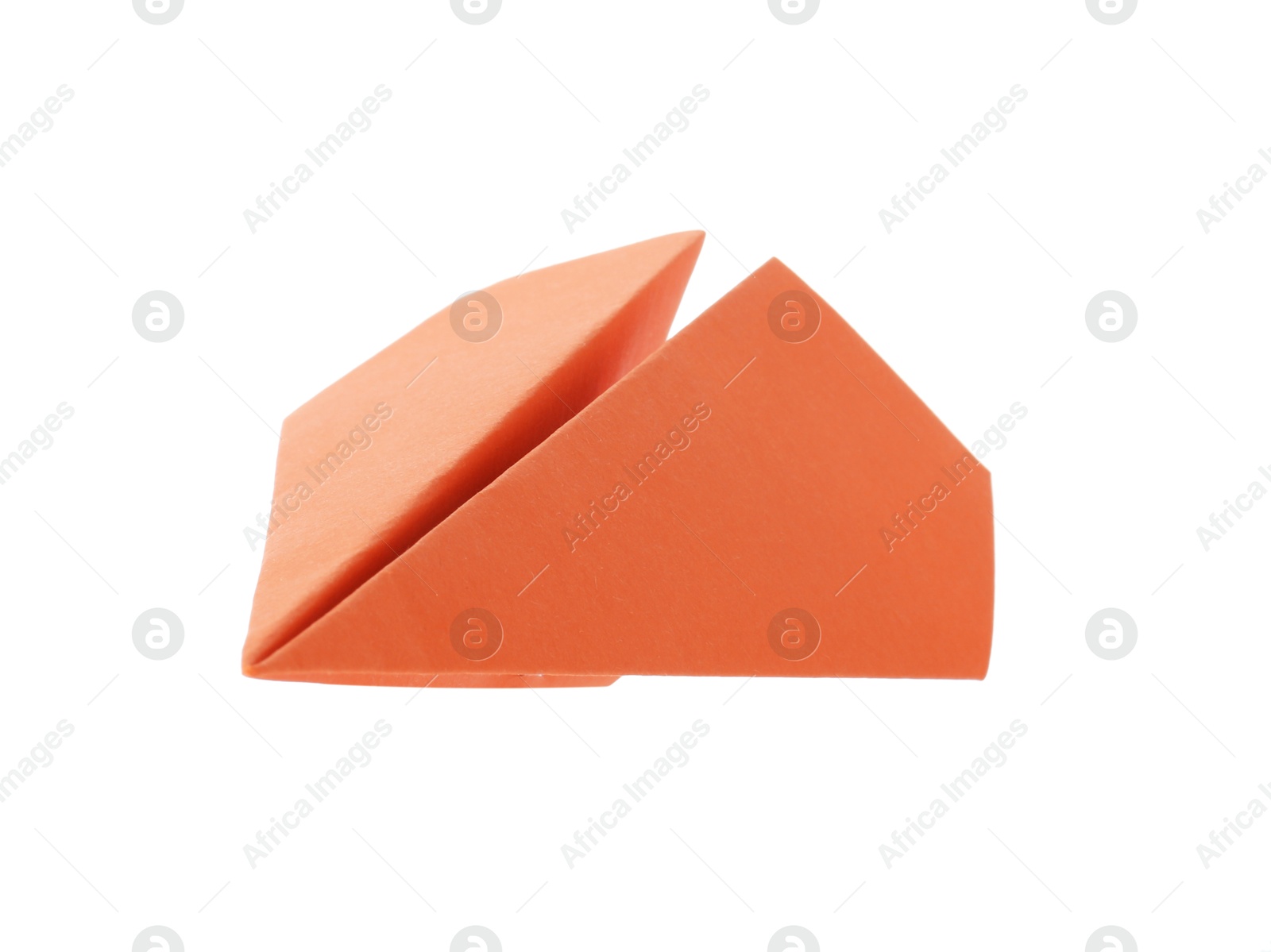 Photo of One handmade orange paper plane isolated on white