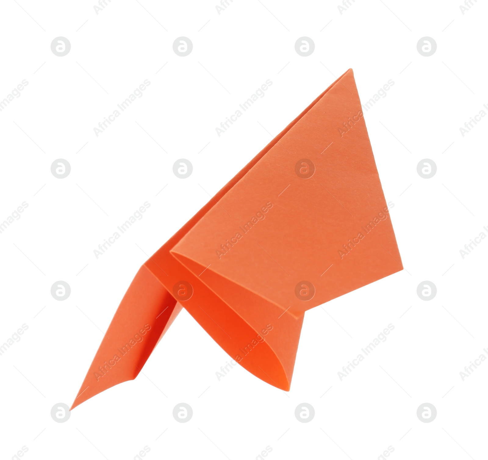 Photo of One handmade orange paper plane isolated on white