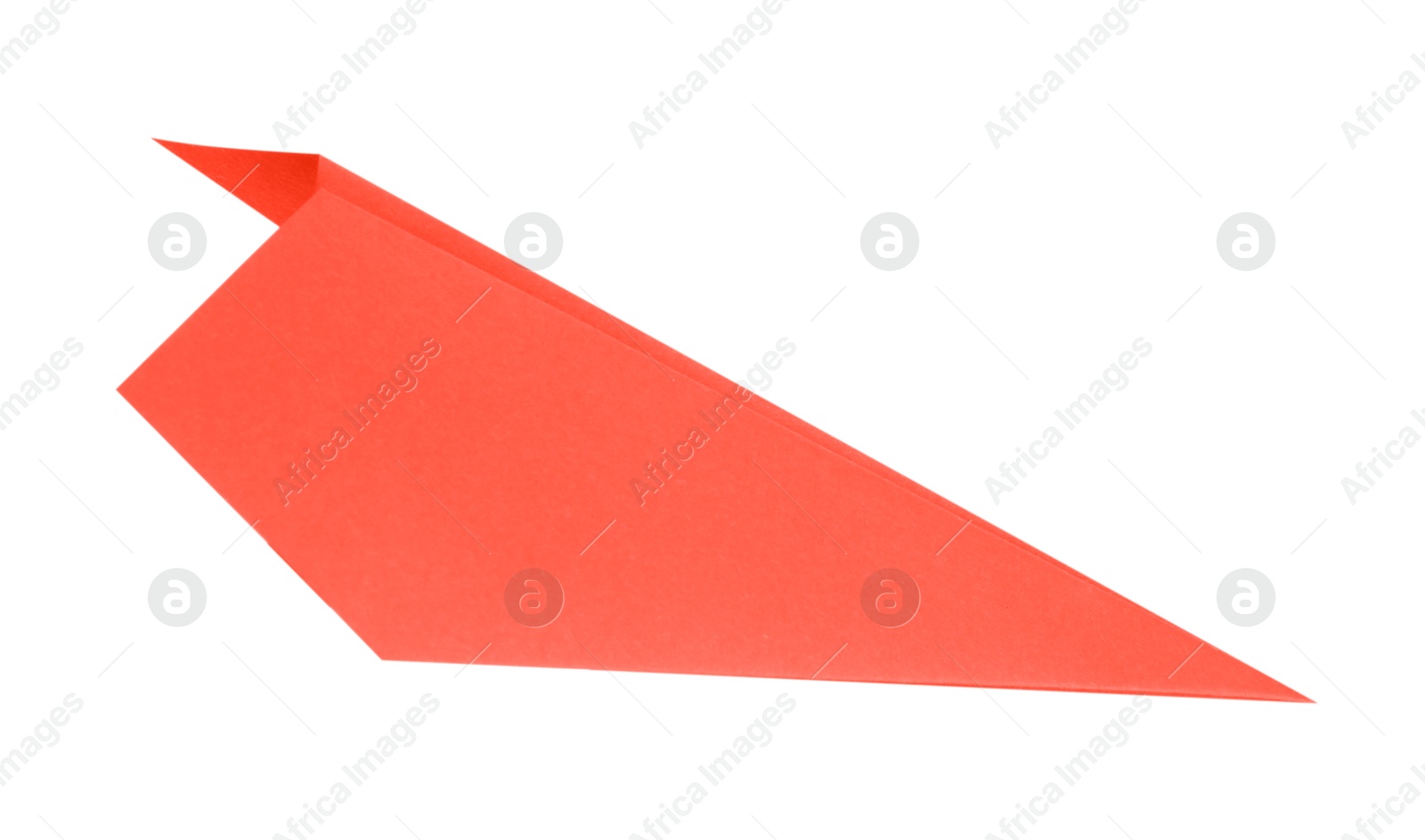 Photo of One handmade coral paper plane isolated on white