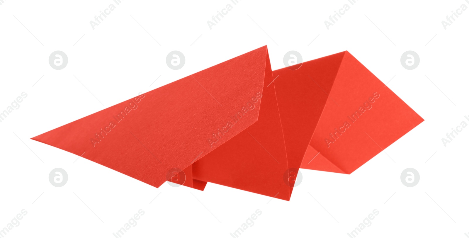 Photo of One handmade coral paper plane isolated on white