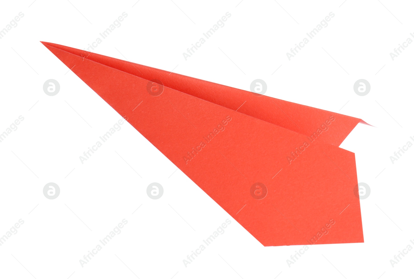 Photo of One handmade coral paper plane isolated on white