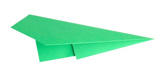 Photo of One handmade green paper plane isolated on white