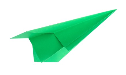 Photo of One handmade green paper plane isolated on white