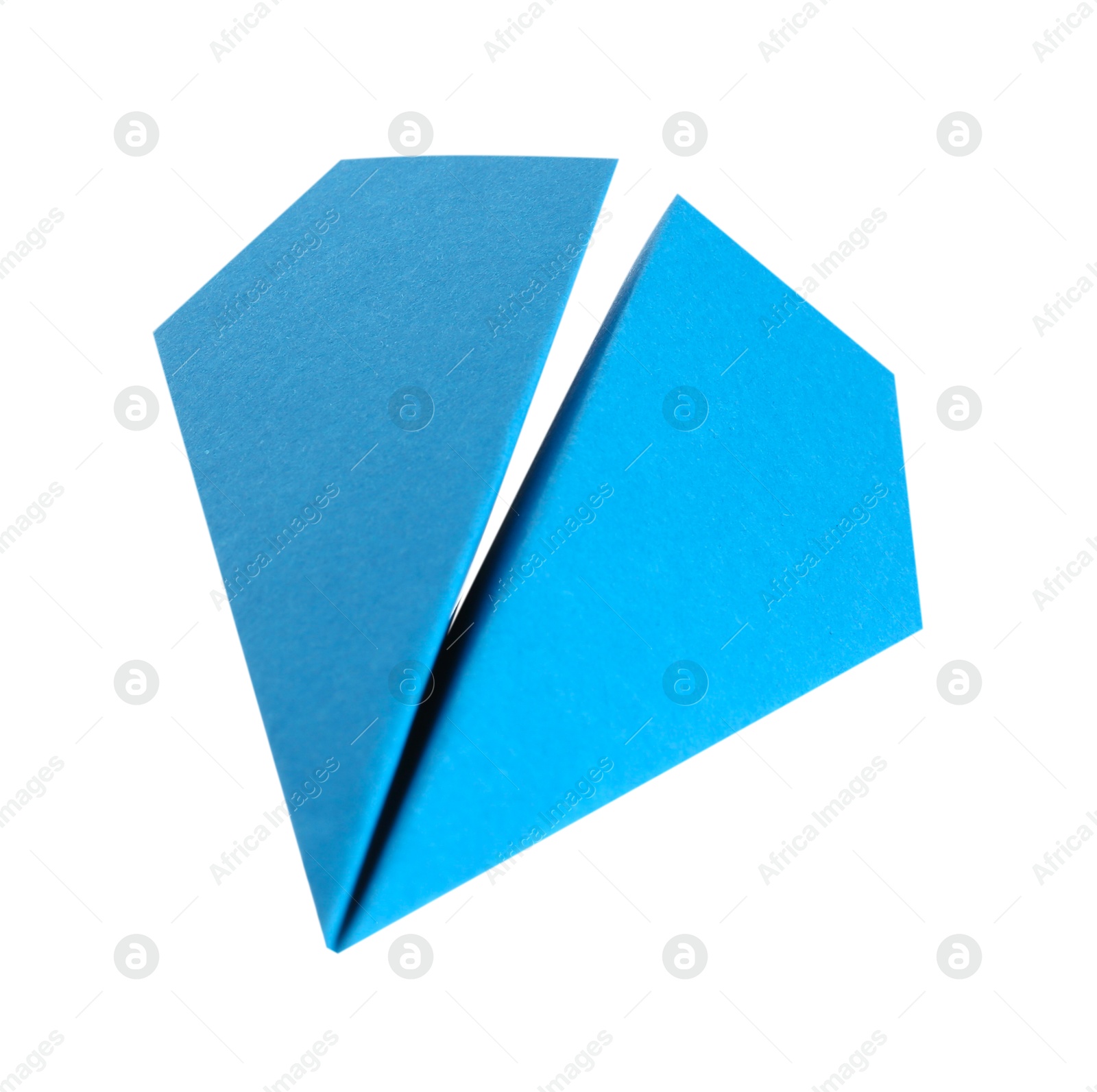 Photo of One handmade light blue paper plane isolated on white