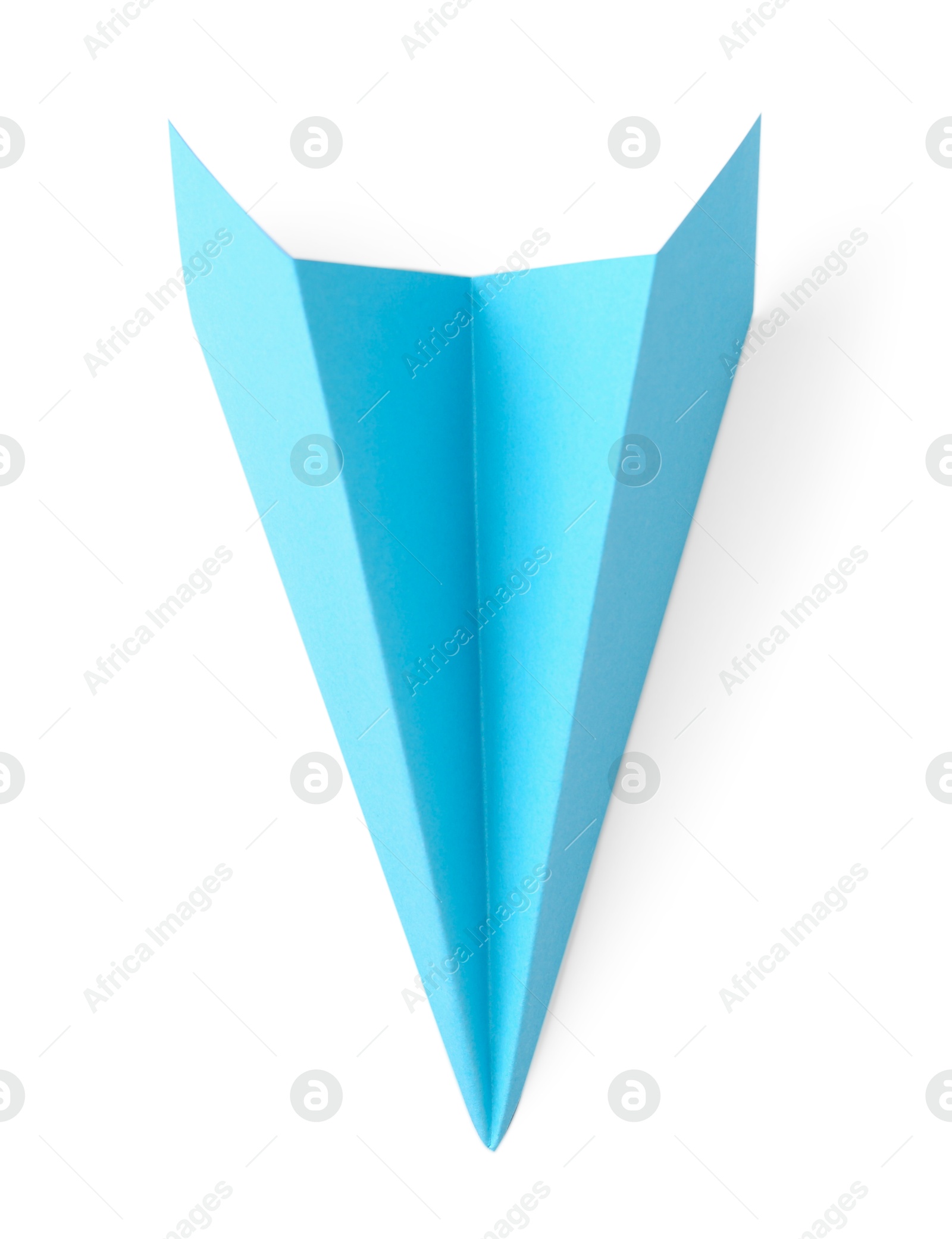 Photo of One handmade light blue paper plane isolated on white, top view