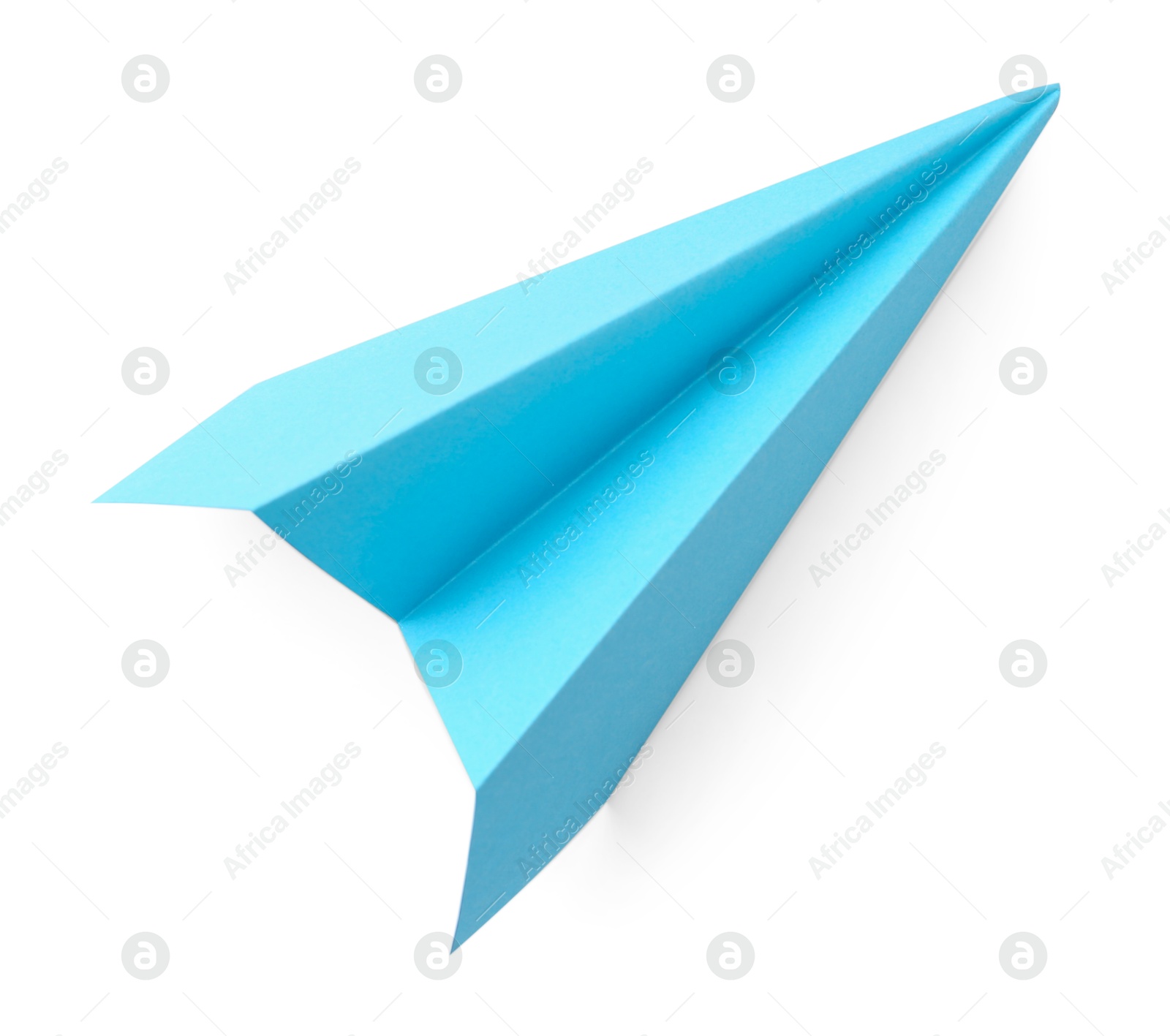 Photo of One handmade light blue paper plane isolated on white, top view