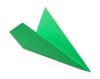 Photo of One handmade green paper plane isolated on white