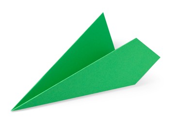 Photo of One handmade green paper plane isolated on white