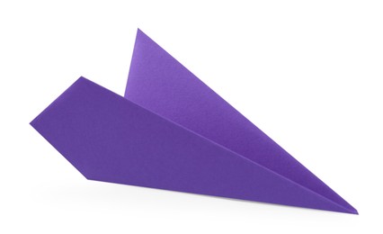 Photo of One handmade purple paper plane isolated on white