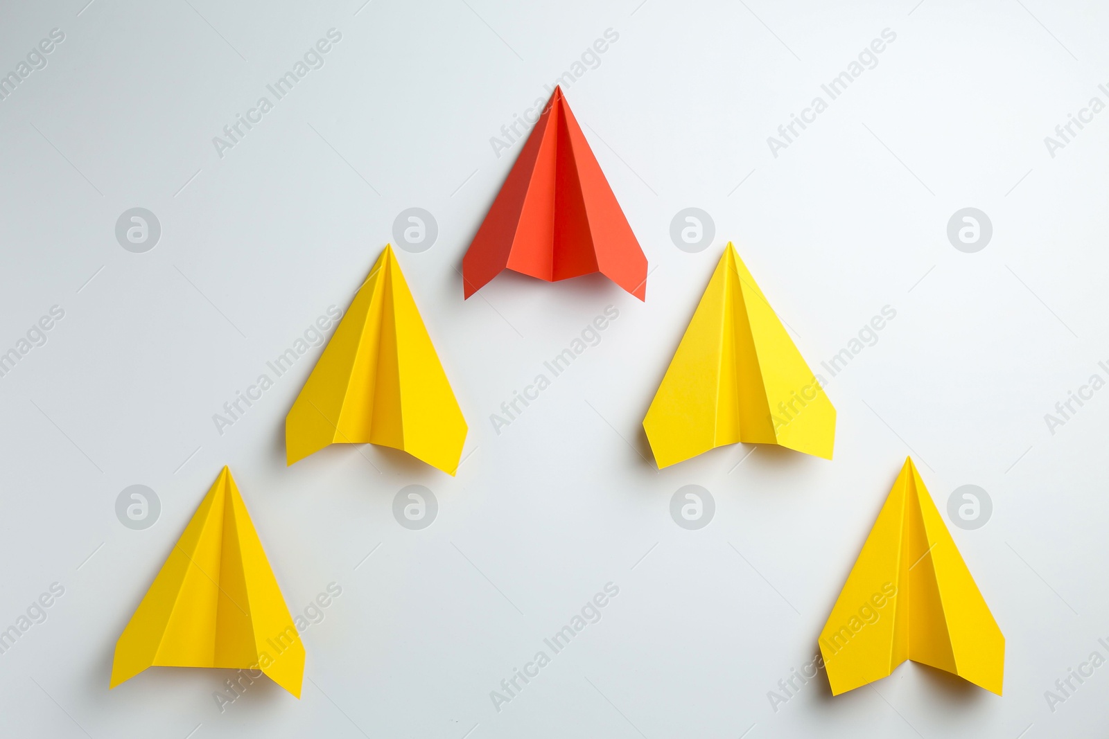 Photo of Handmade color paper planes on white background, flat lay