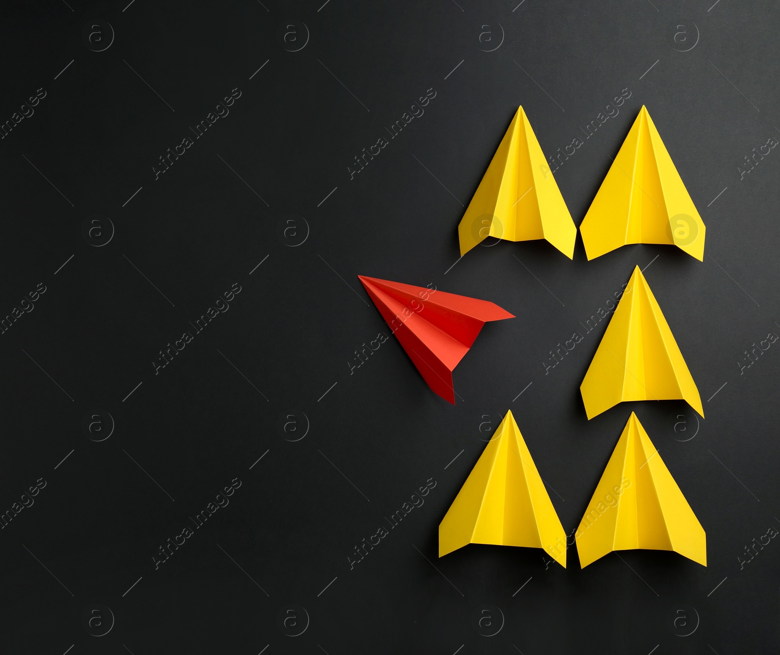 Photo of Handmade color paper planes on black background, flat lay. Space for text