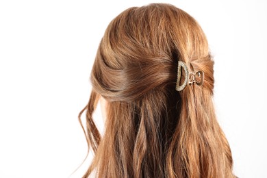 Teenage girl with stylish hair clip on white background, back view