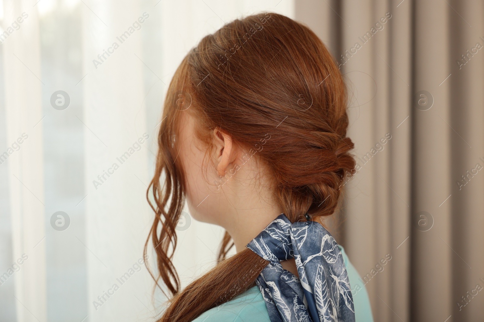 Photo of Teenage girl with stylish bandana indoors, back view