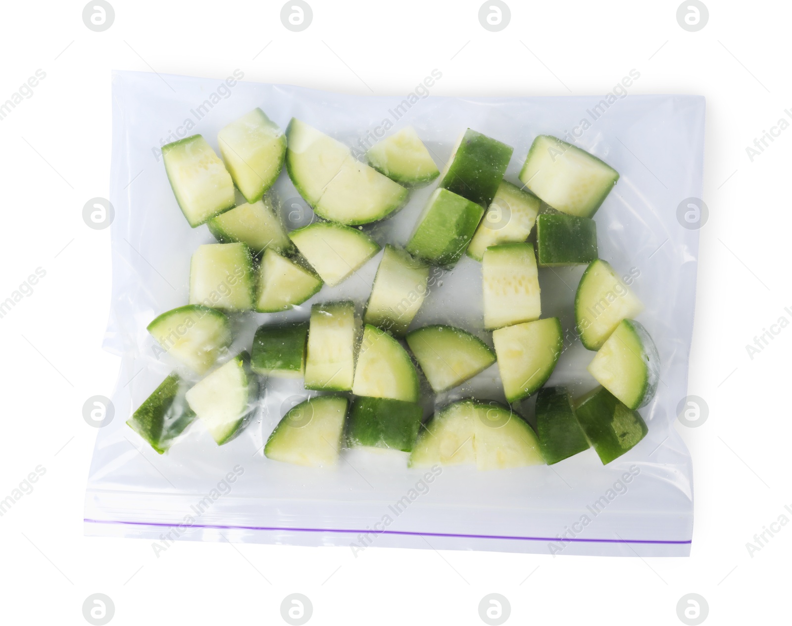 Photo of Frozen chopped zucchini in plastic bag isolated on white, top view