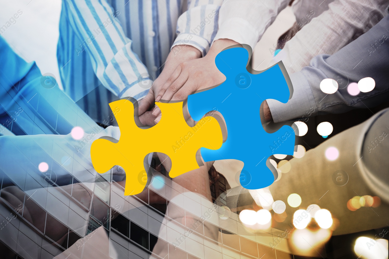 Image of Business partners holding hands together, double exposure with joined puzzle pieces