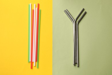 Photo of Different drinking straws on color background, flat lay