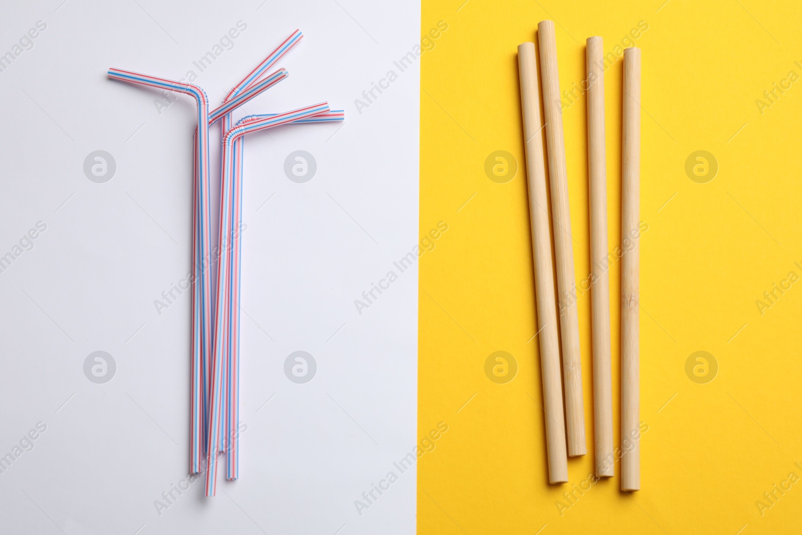 Photo of Different drinking straws on color background, flat lay