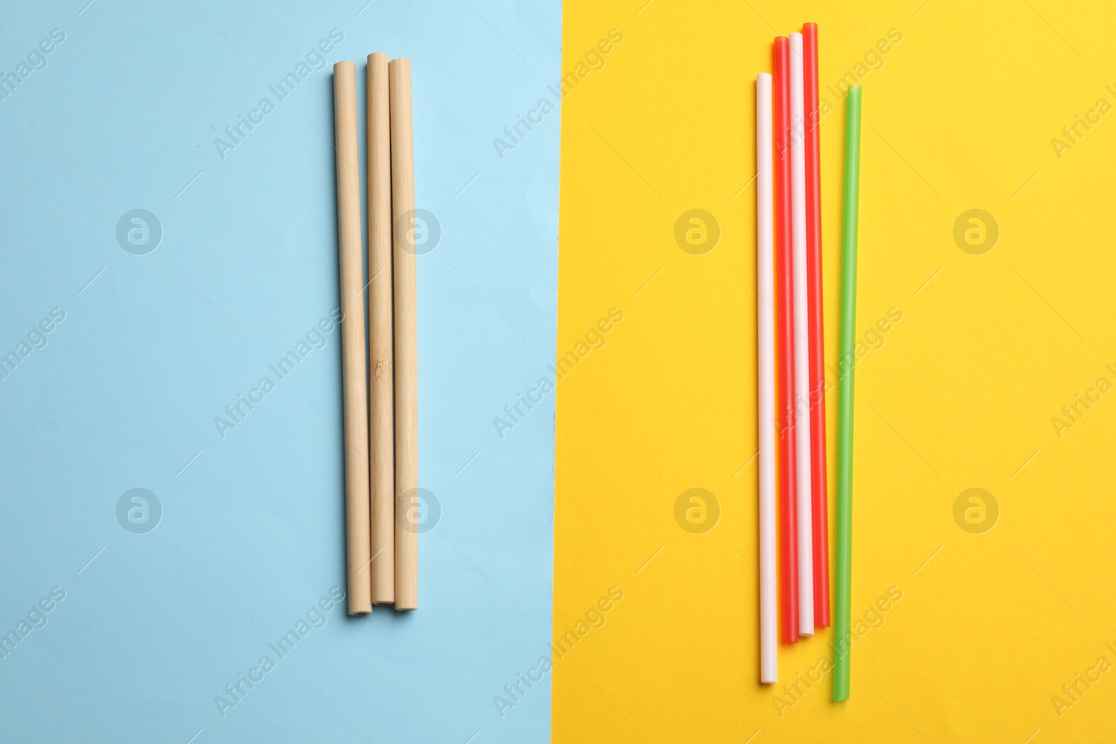 Photo of Different drinking straws on color background, flat lay