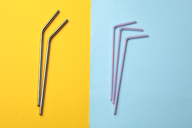 Photo of Different drinking straws on color background, flat lay