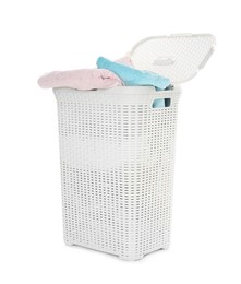 Photo of Wicker basket full of laundry isolated on white