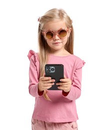 Photo of Cute little girl with smartphone on white background