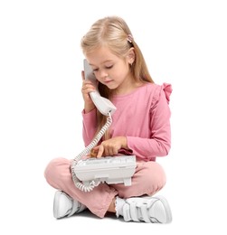 Cute little girl with telephone on white background