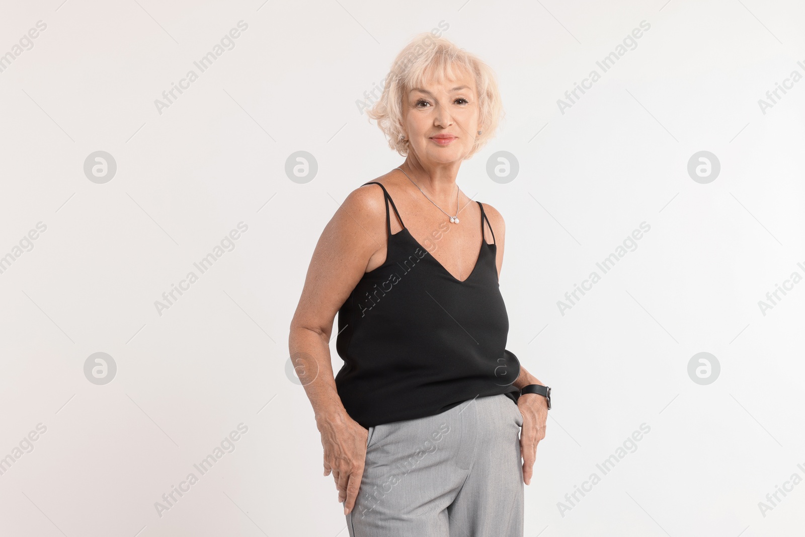 Photo of Portrait of beautiful senior woman on white background