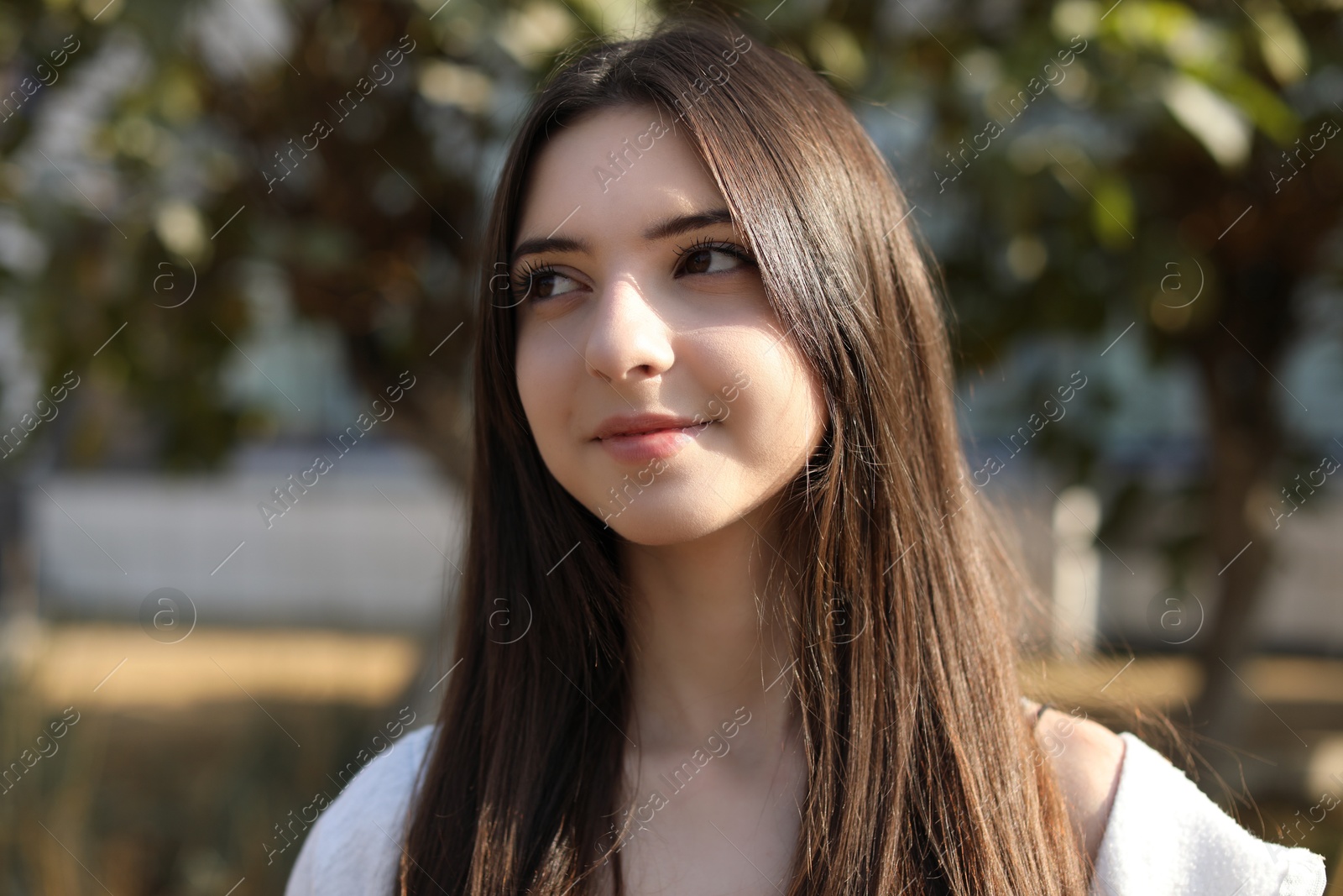 Photo of Portrait of beautiful teenage girl on city street