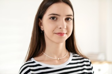 Photo of Portrait of beautiful teenage girl at home