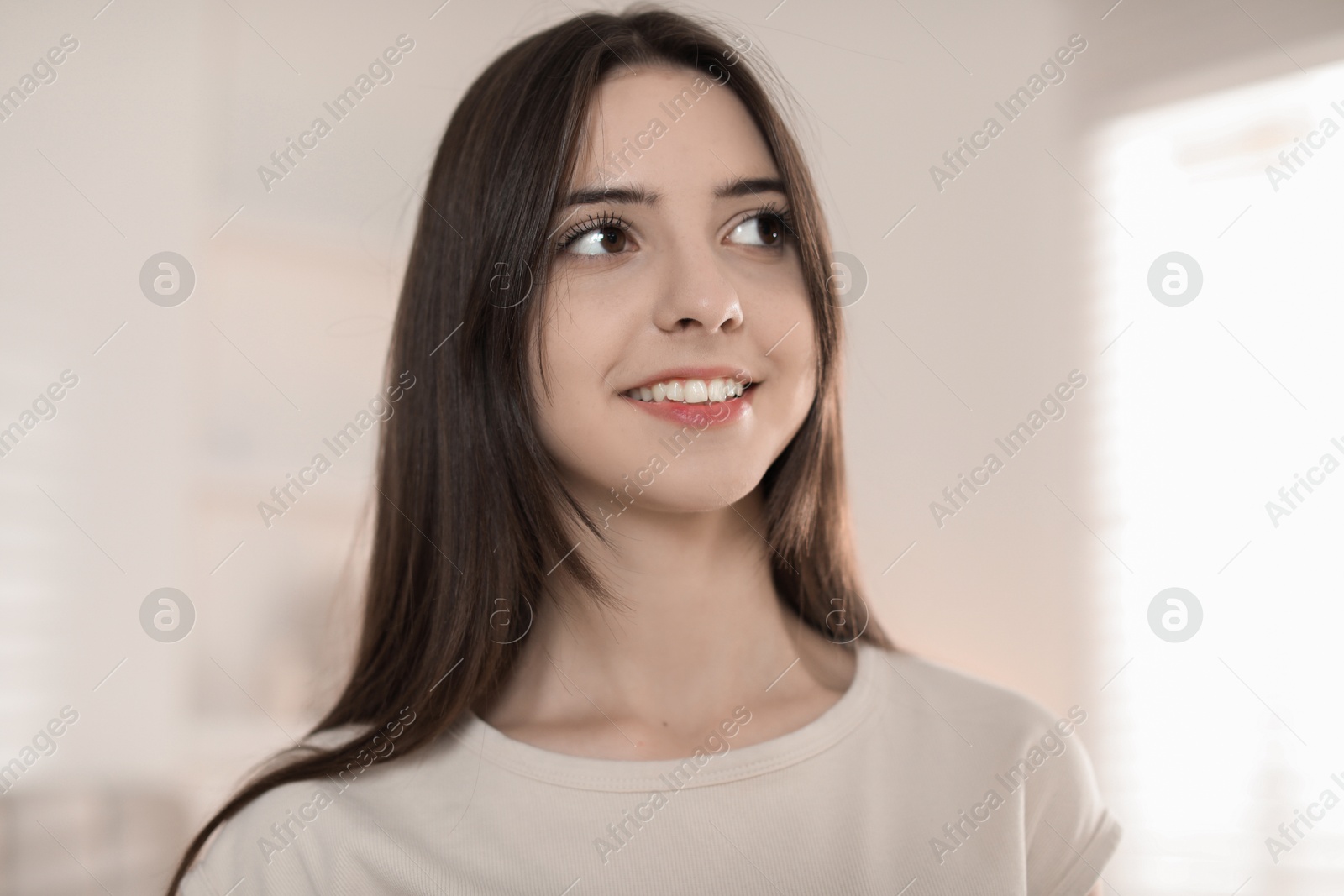 Photo of Portrait of happy teenage girl at home