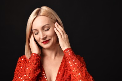 Photo of Woman with perfect makeup on black background